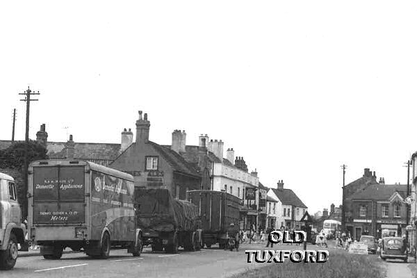 Lorries held up by the May Day procession on what was the Great North Road