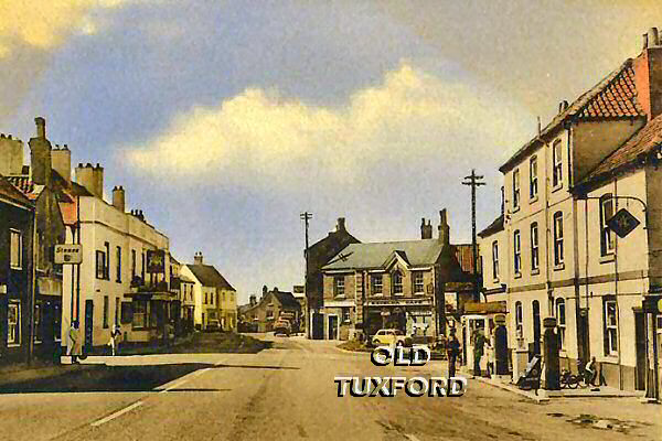 Looking towards the Market Place, Sanderson's garage at right, lollipop lady outside the Sun Inn